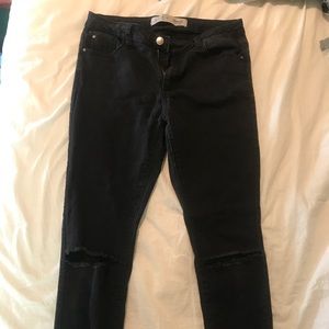Black jeans with slit knees